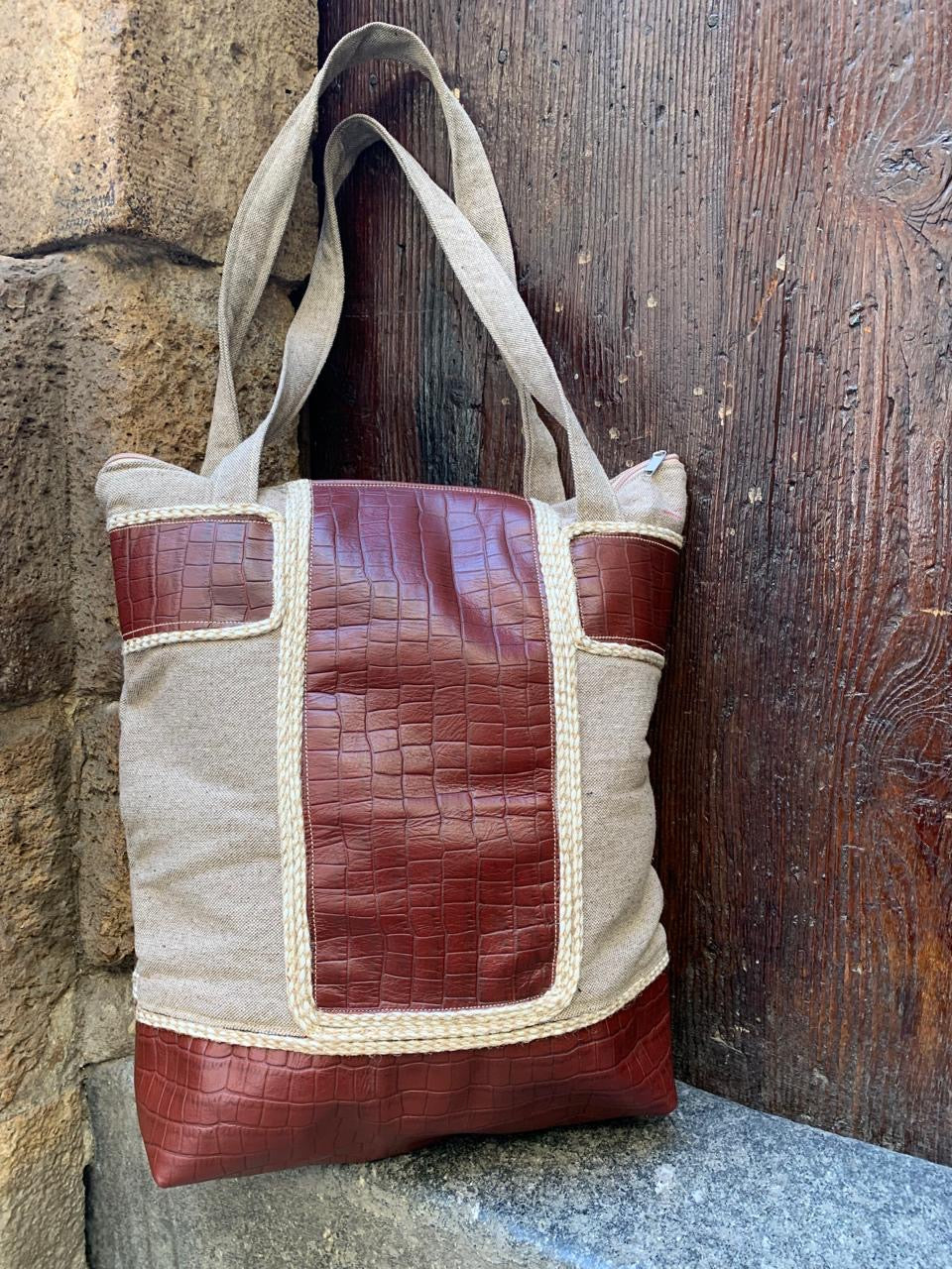 The brownish leather shoulder bag