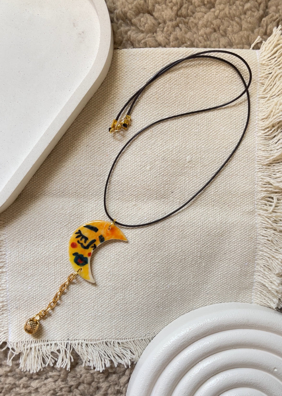 The moon face in yellow necklace