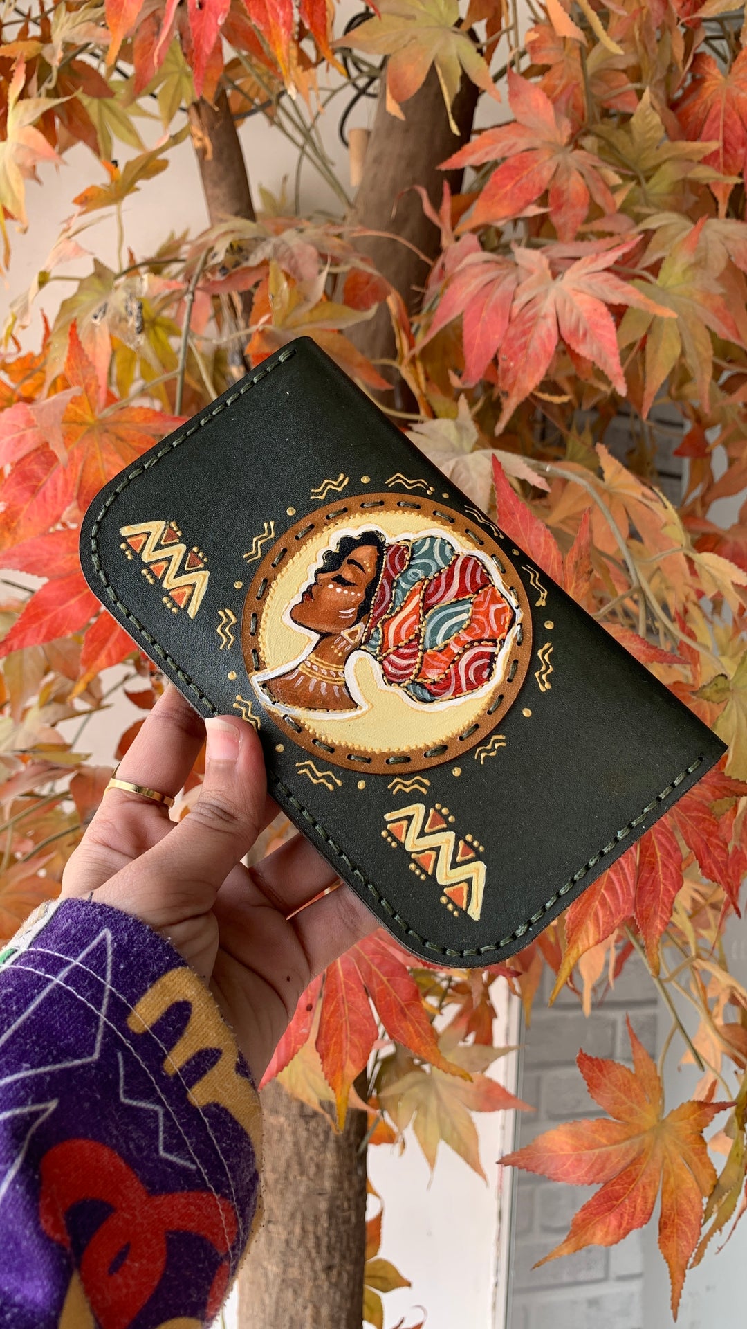 The Afro lady in dark Leather wallet