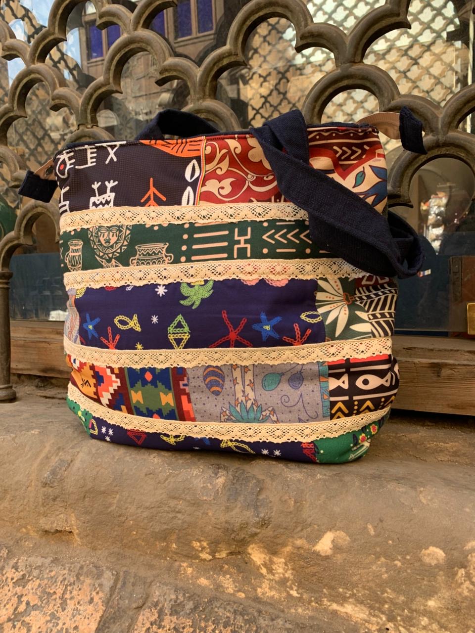 The strip patches shoulder bag