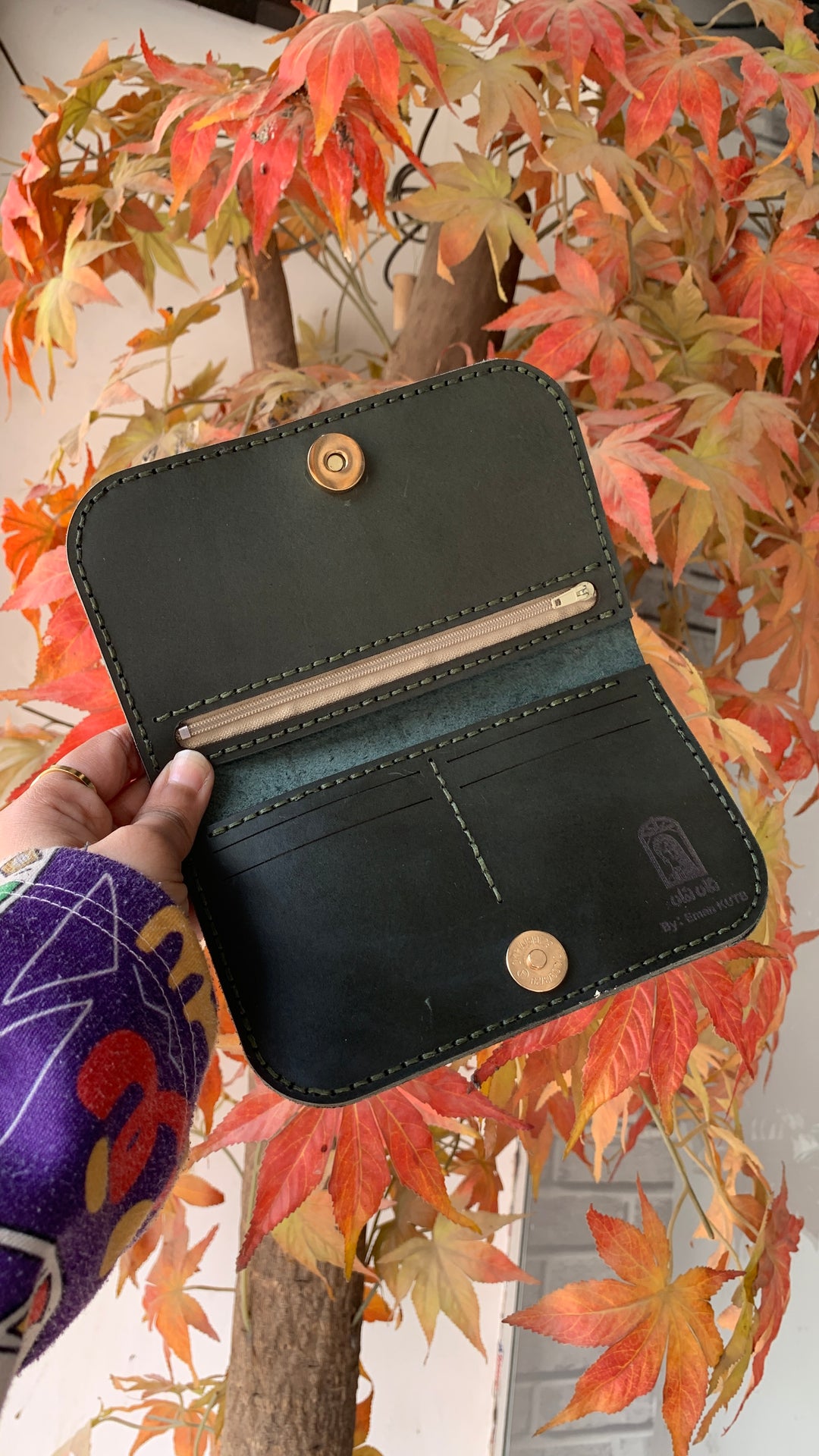 The Afro lady in dark Leather wallet