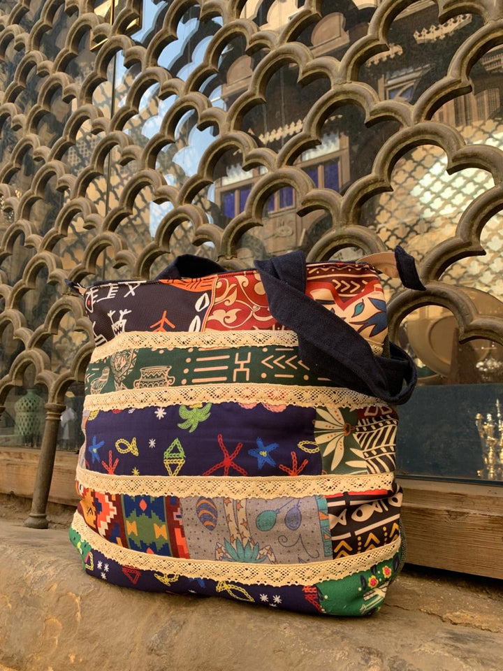 The strip patches shoulder bag