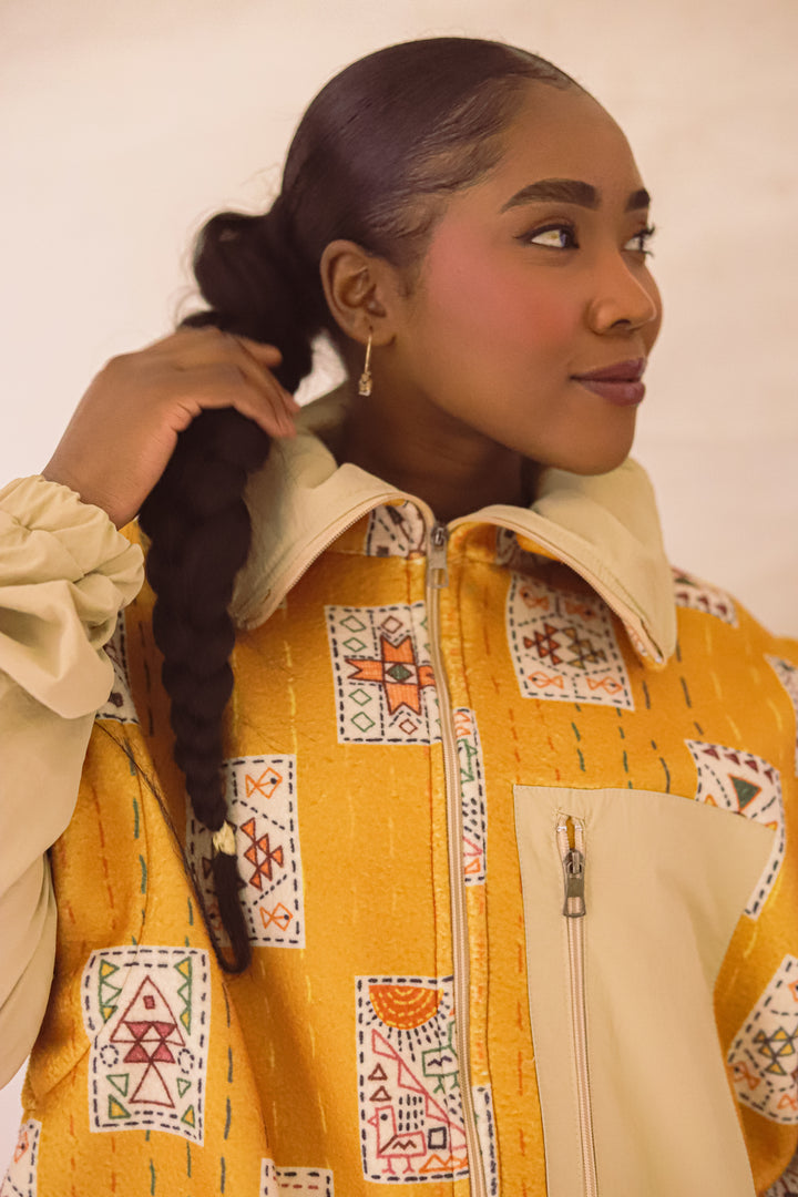 Embroidery stitches yellow jacket/vest
